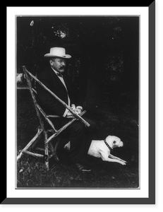Alton Brooks Parker, 1852-1926, full length portrait, seated in rustic chair, facing right; with dog on lawn; wearing straw hat, Vintage Wall Art