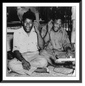 Natives of Bikini Island before atomic bomb test: two seated men holding radio headphones to their ears, Antique Wall Art