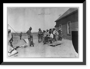 Historic Framed Print, [Mexican War, 1914: U.S. soldiers interviewing Mexican refugees; man wearing bowler hat and Red Cross armband seated in center],  17-7/8" x 21-7/8"