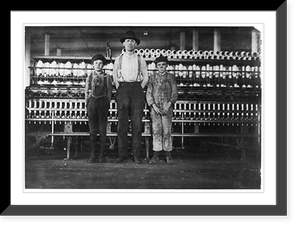Historic Framed Print, Overseer and two of the doffer boys, Charles Hennessy and John Douglass in Avondale Mills. Noon hour. Overseer said, we've got 30 of 'em." Location: Birmingham,  Alabama.",  17-7/8" x 21-7/8"