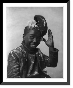 Grinning African American boy with hat knocked askew by snowball, Historic Print