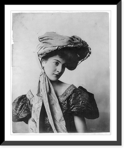 Young woman modeling: Half lgth., 2 long pieces of material draped from hat over body, Antique Wall Art