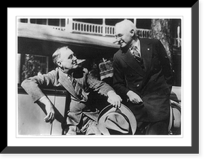 Franklin D. Roosevelt seated, 3/4 lgth., on edge of car seat, with door open, facing an unidentified man, who is standing alongside, Historic Print