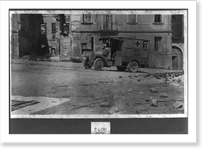Antique Photo Print - A.R.C. ambulance in a shelled town at the Front