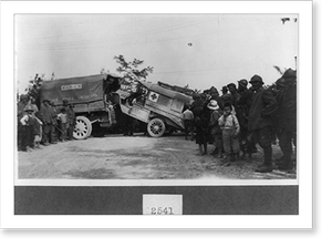 Black & White Photo - A wrecked American Red Cross ambulance being