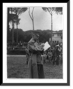 Army and Navy baseball game, Rome Italy: Maj. Hereford, official scorer, standing with score sheet, Historic Print