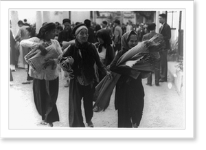 Historic Street Photo - Vietnam: Three women carrying goods in foregrd