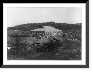 Grass roofed native houses and wooden Presbyterian church, Vintage Print