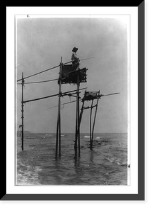 Historic Architecture - Fisherman in bamboo tower watching for fish