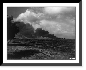 First Army photos of the bombing of Hawaii, Dec. 7, 1941. Smoke from Pearl Harbor and Hickam Field as seen from Kan Highway near John Rodgers Airport Road, Historic Reproduction
