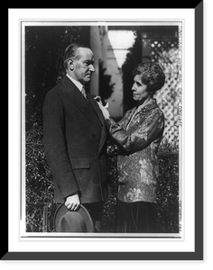 Historic Framed Print, [Mr. & Mrs. Calvin Coolidge standing, 3/4 lgth., with Mrs. Coolidge putting pin? on Mr. Coolidge's coat lapel],  17-7/8" x 21-7/8"
