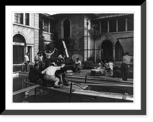 Historic Framed Print, [Gloria Swanson acting in Paramount's Sunset Boulevard,  with Director Billy Wilder behind camera, seated over swimming pool, at a Wilshire Boulevard mansion in Los Angeles],  17-7/8" x 21-7/8"