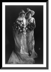 Mrs. Frederick Bourne and sister, full-length portrait, standing, wearing gowns and holding flowers, Antique Wall Art