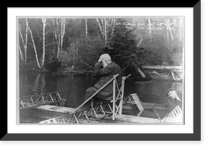 Alexander Graham Bell seated on experimental boat, a floating tetrahedral structure, with his right hand raised to his forehead, Baddeck, Nova Scotia, Vintage Poster