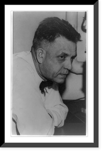Dr. Alfred C. Kinsey, half-length portrait, leaning on desk, facing right, arms folded, Historic Reproduction