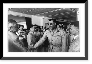 Egyptian President Gamal Abdel Nasser shaking hands with Japanese chief delegate Tatsunosuke Takasaki at the Afro-Asian Conference. Chinese premier Chou En- lai is in center Heritage Wall Art Pri