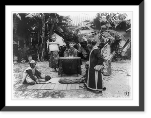 Elderly man watching two young boys holding another young boy down on a mat while standing man reads scroll Classic, Vintage Print