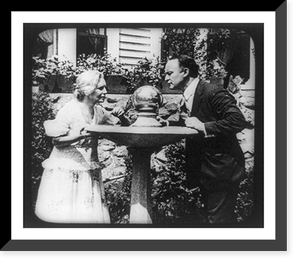 Harry Houdini and woman looking at crystal ball, Historic Reproduction