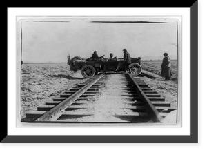 Historic Framed Print, [Automobile straddling railroad tracks during race between New York and San Francisco],  17-7/8" x 21-7/8"