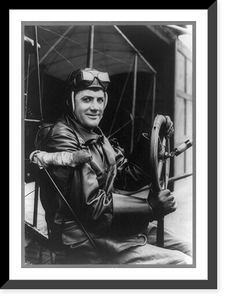 Historic Framed Print, [F.B. Hennessy, Army aviator, three-quarter length portrait, seated at steering wheel of airplane, facing right, in aviator's clothes],  17-7/8" x 21-7/8"