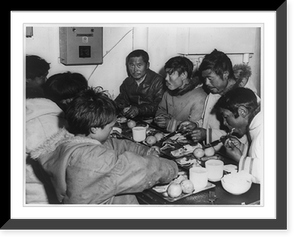 Eskimos eating aboard the icebreaker Eastwind on a Coast Guard hydrographic mission on Baffin Island, Antique Poster