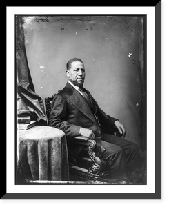 Hiram Rhoades Revels, Afro-American senator, three-quarter length portrait, seated by small table, facing right, Historic Reproduction