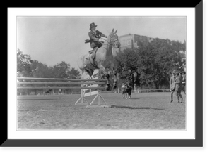 Historic Framed Print, [Mrs. William Mitchell sidesaddle on horse jumping hurdle],  17-7/8" x 21-7/8"