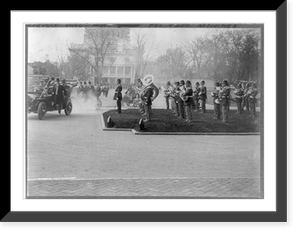 Arrival of Pres. Theodore Roosevelt at the armory. Pres. Roosevelt and others in 3 automobiles and military band, Historic Reproduction