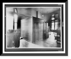 Historic Framed Print, [Postal service offices with man seated at desk, U.S. Post Office, Washington, D.C.].National Photo Co., Washington, D.C.,  17-7/8" x 21-7/8"