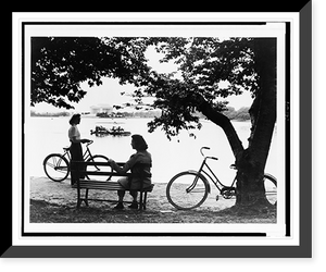 Historic Framed Print, [Tidal Basin, Washington, D.C., two young women with bicycles in foreground, tour(?) boat on water, Jefferson Memorial in background],  17-7/8" x 21-7/8"