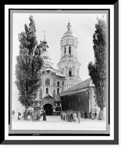 Monastery in Kiev with crowd of people standing outside entrance, looking toward camera Classic, Antique Print