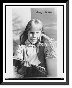 Historic Framed Print, [Amy Carter, half-length portrait, facing front, holding book],  17-7/8" x 21-7/8"