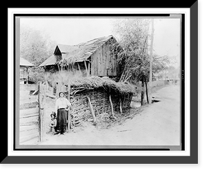 Woman and child standing by fence of farmyard, Romania Classic, Vintage Print