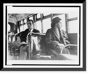 Rosa Parks, three-quarter length portrait, seated toward front of bus, facing right, Montgomery, Alabama, Vintage Print