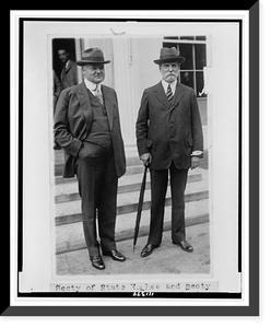 Historic Framed Print, [Secretary of State Charles Evans Hughes and Secretary of Commerce Herbert Hoover, full-length portraits, standing, outside of building],  17-7/8" x 21-7/8"