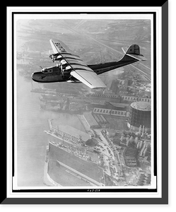 Historic Framed Print, [Aerial view of Pan American Airways China Clipper" over Grove(?) Street Municipal Terminal,  Oakland,  California].Clyde H. Sunderland,  commercial and aerial photographs,  Oakland,  California.",  17-7/8" x 21-7/8"