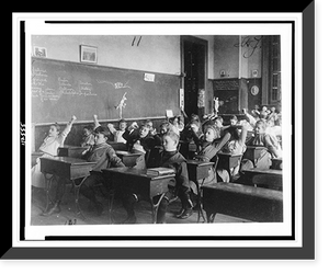 Historic Framed Print, [Children seated at desks in Washington, D.C. classroom, stretching],  17-7/8" x 21-7/8"