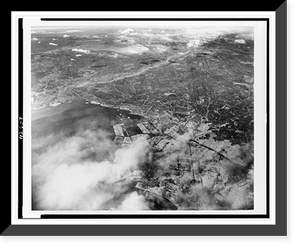 Aerial photo of Tokyo showing effects of first large-scale incendiary bombing attack by U.S. 20th Air Force operations - 2 Classic, Vintage Poster