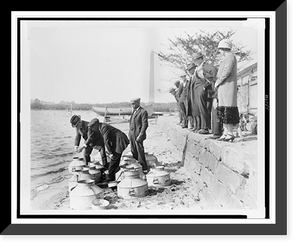 Historic Framed Print, [U.S. Fish Commissioner, Henry O'Malley, stocking fish in the Potomac River, at the Tidal Basin, Washington, D.C., with the Washington Monument in the background],  17-7/8" x 21-7/8"