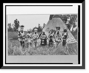 Group of Siksika (Blackfeet) men and one woman singing in front of tipi, Vintage Poster