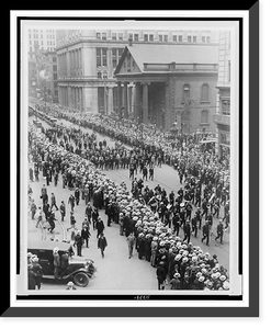 Parade for Richard Byrd, on his return from the North Pole, New York City, showing the crowds, and and also directly behind the band, Grover Whalen, Commander Byrd, and Floyd Bennett, his pilot T