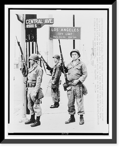 Three National Guardsmen stand guard under a Los Angeles city limits sign in the southern end of the riot torn section of the city, Historic Print