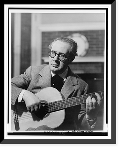Andr&eacute;s Segovia, half-length portrait, seated, facing slightly left, playing guitar.photograph by Peggy Duffy, Vintage Wall Art