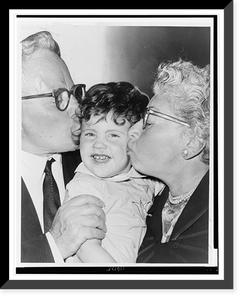 Mr. and Mrs. Julius Galin greet their granddaughter, Debbie Schneer, with kisses.World Telegram & Sun photo by Roger Higgins, Antique Print