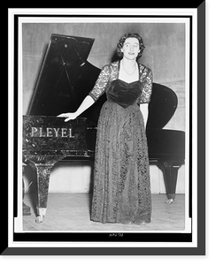 Micheline Ostermeyer, full-length portrait, standing, facing front, in front of a piano, Historic Print
