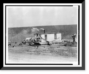 Woman holding child on houseboat stranded on the banks of the Mississippi River, Vintage Print