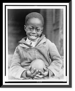 African American boy holding a piece of fruit received through the Red Cross drought relief work in Mississippi Classic, Vintage Wall Art