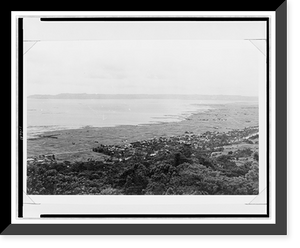 Aerial view of village in distance, and damaged coastline, which had been protected by a sea wall in pre-war years, Okinawa, Antique Wall Art