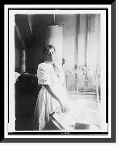 African American woman, three-quarter length portrait, standing, facing front, doing laundry at wash tub, in Washington, D.C. or New York, Vintage Print