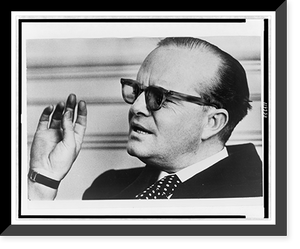 Historic Framed Print, [Truman Capote, head-and-shoulders portrait, facing left, wearing sunglasses, gesturing and speaking],  17-7/8" x 21-7/8"